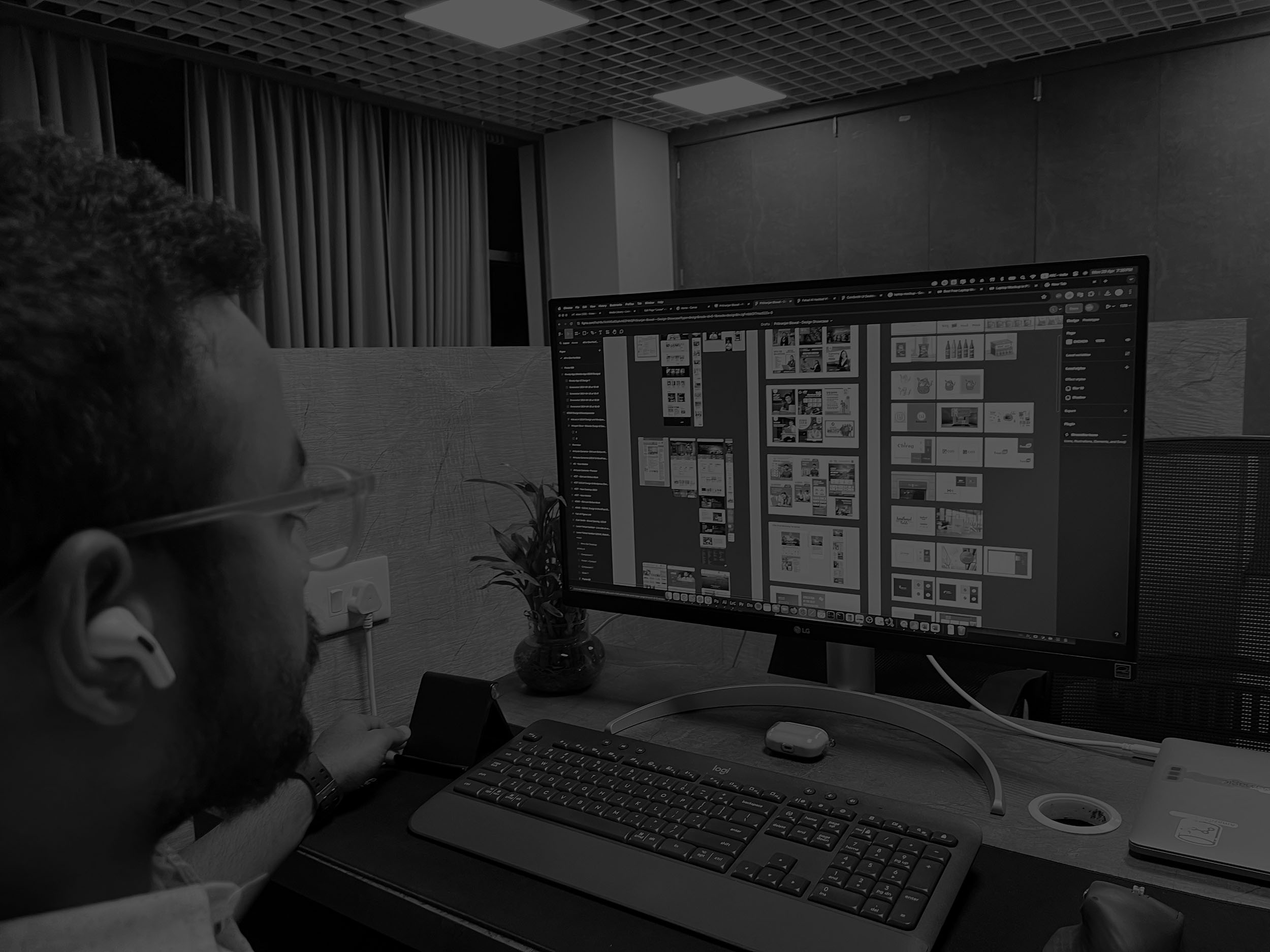 Pritiranjan at his desk, designing in Figma on a wide monitor